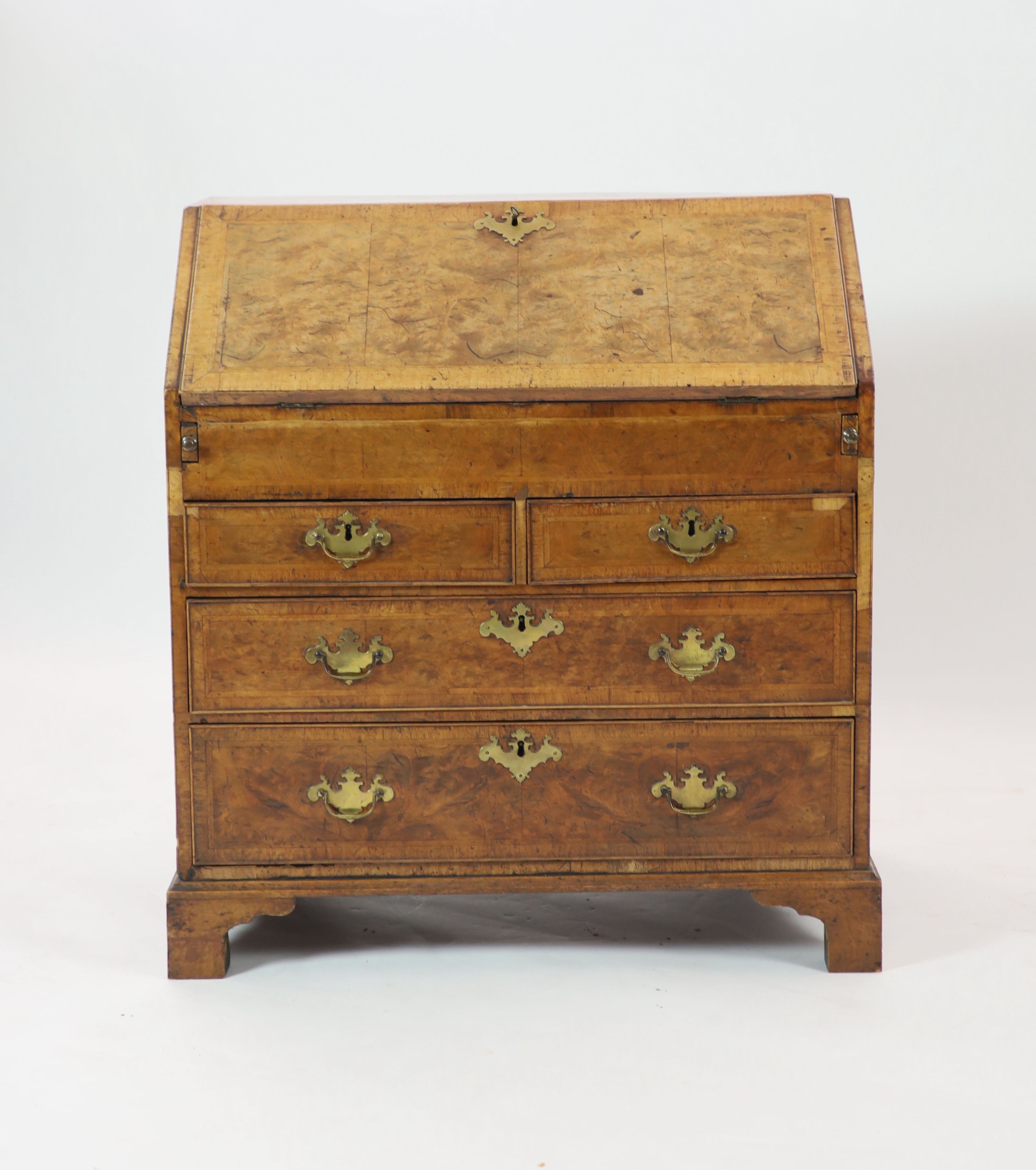 A George II walnut bureau H 101cm. W 92cm. D 53cm.